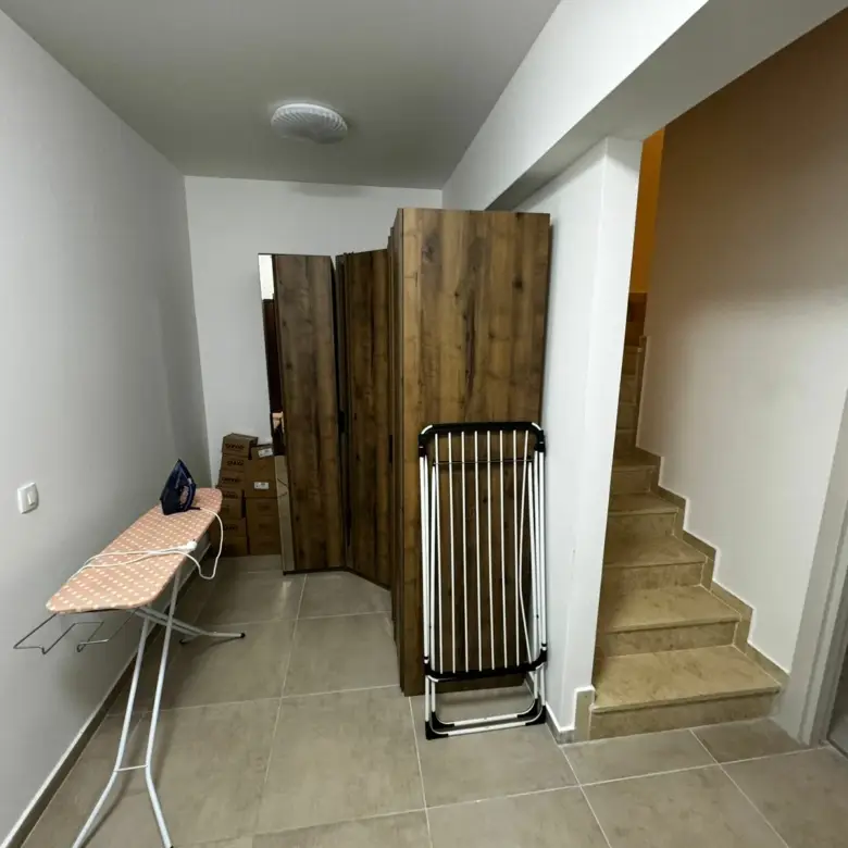 Invest in Ulcinj, Montenegro: functional hallway with storage, wardrobe, and stairs to additional rooms. Listed by ekosphere doo.