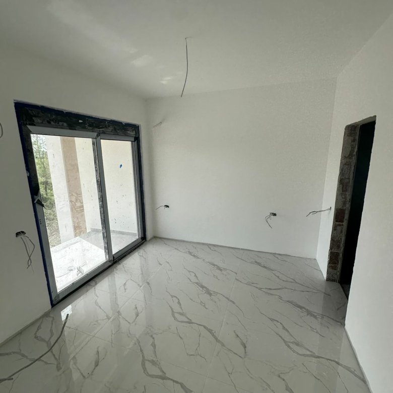 Bright, modern room in Ulcinj with marble tiles and glass doors&mdash;ideal Montenegro investment. Ekosphere doo project at immorenta.me.