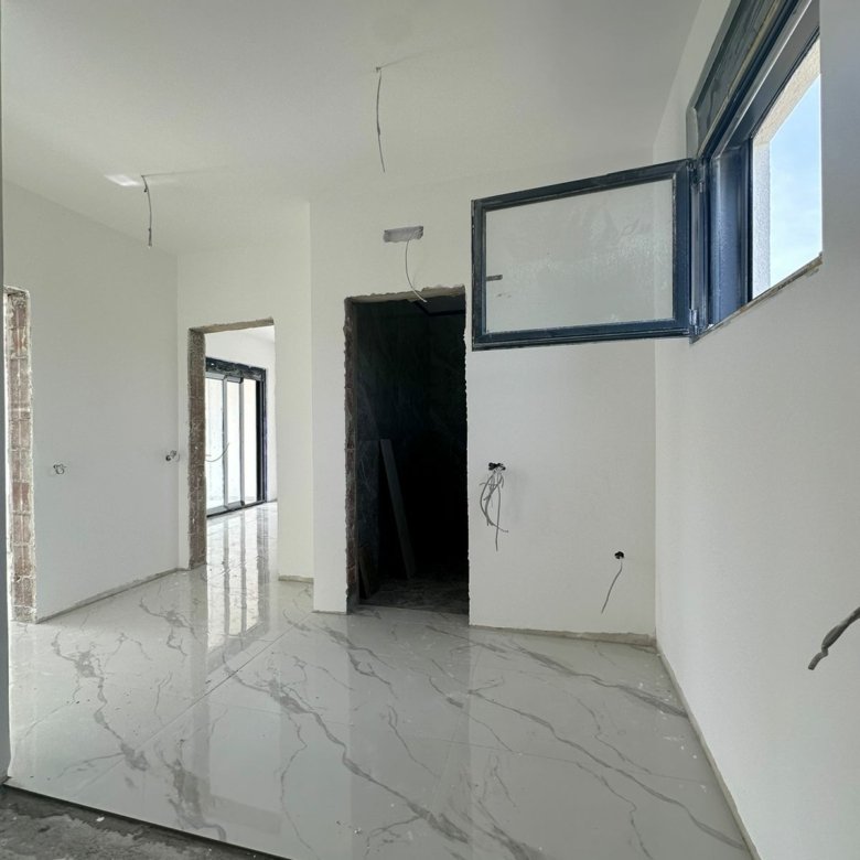 Bright, under-construction space in Ulcinj with marble tile floors&mdash;prime real estate by immorenta.me, powered by Ekosphere doo.