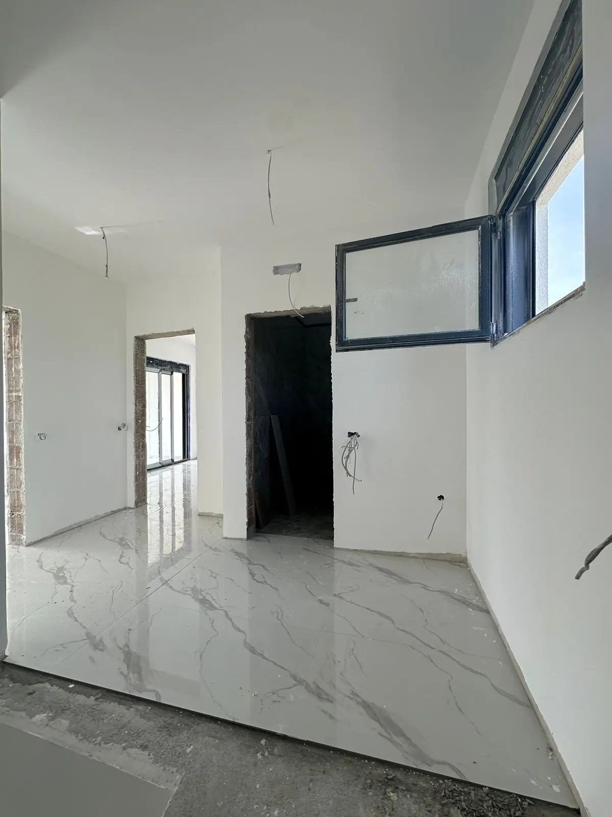 Bright, under-construction space in Ulcinj with marble tile floors&mdash;prime real estate by immorenta.me, powered by Ekosphere doo.