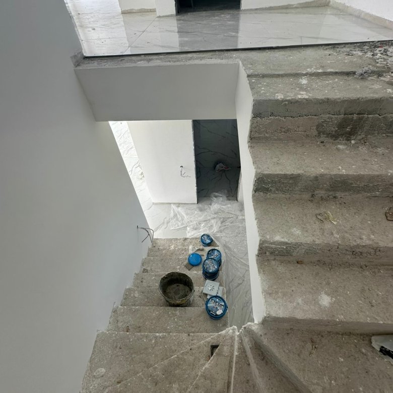 Spacious unfinished interior in Ulcinj, Montenegro with concrete stairs&mdash;prime real estate investment by Ekosphere on immorenta.me.