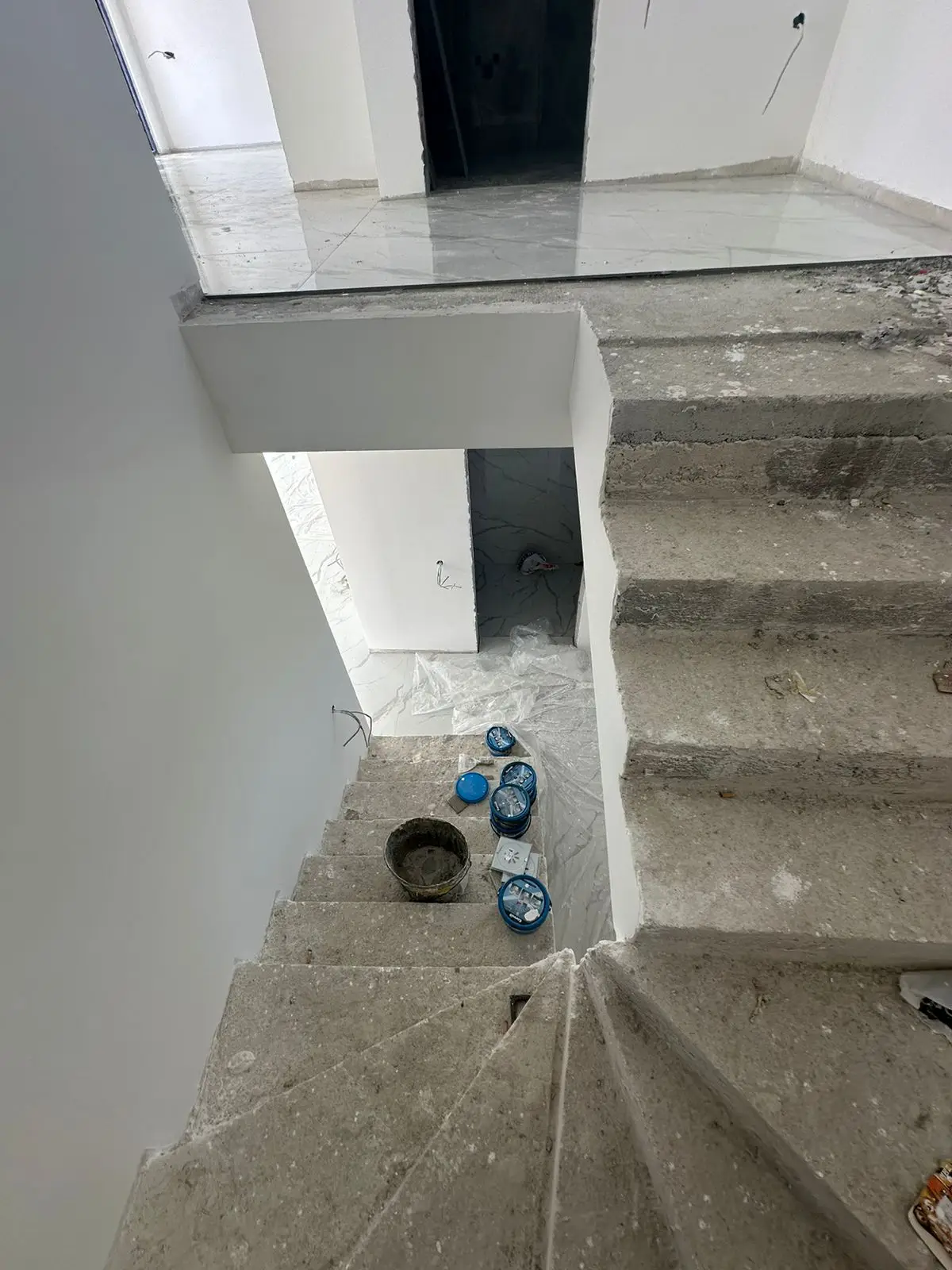 Spacious unfinished interior in Ulcinj, Montenegro with concrete stairs&mdash;prime real estate investment by Ekosphere on immorenta.me.