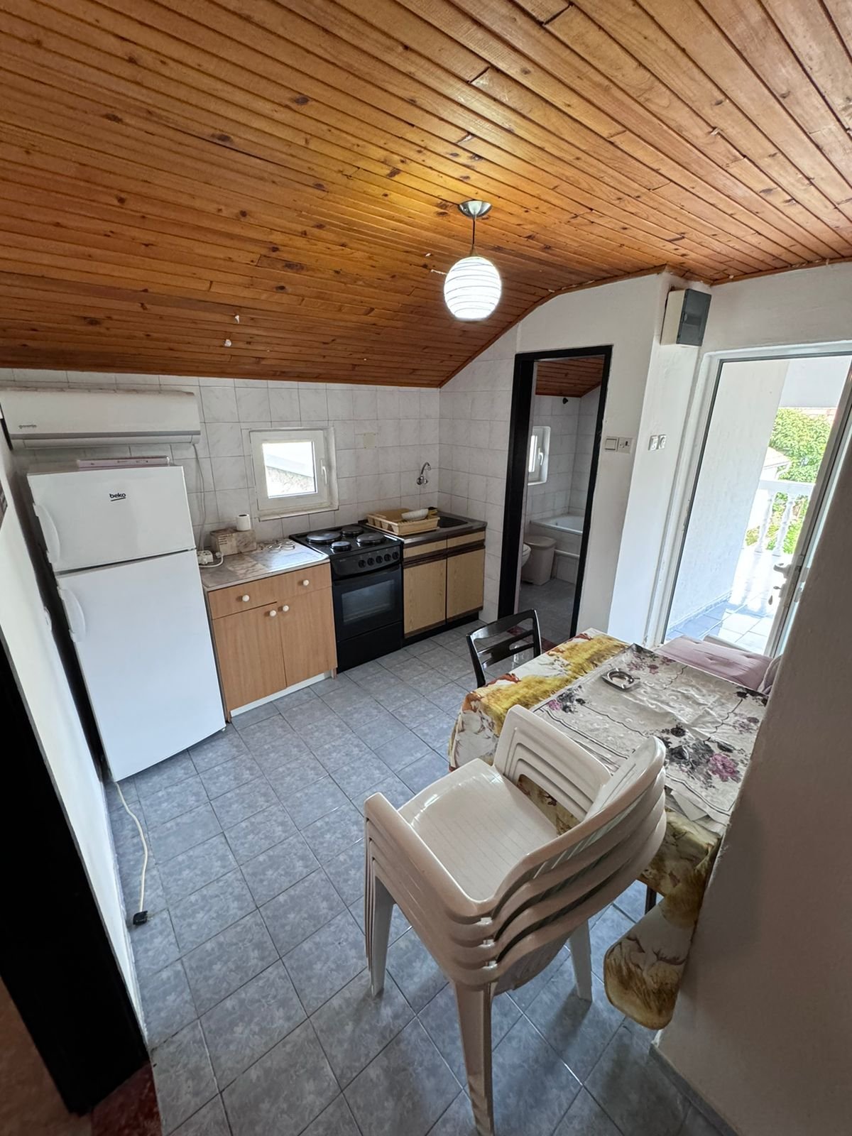 Charming Ulcinj apartment: cozy kitchen & dining, wood ceiling, outdoor access. Prime investment on immorenta.me by ekosphere doo.