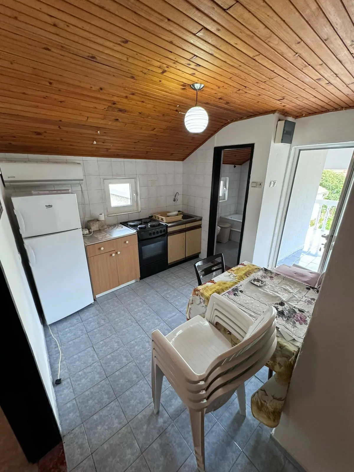 Charming Ulcinj apartment: cozy kitchen & dining, wood ceiling, outdoor access. Prime investment on immorenta.me by ekosphere doo.