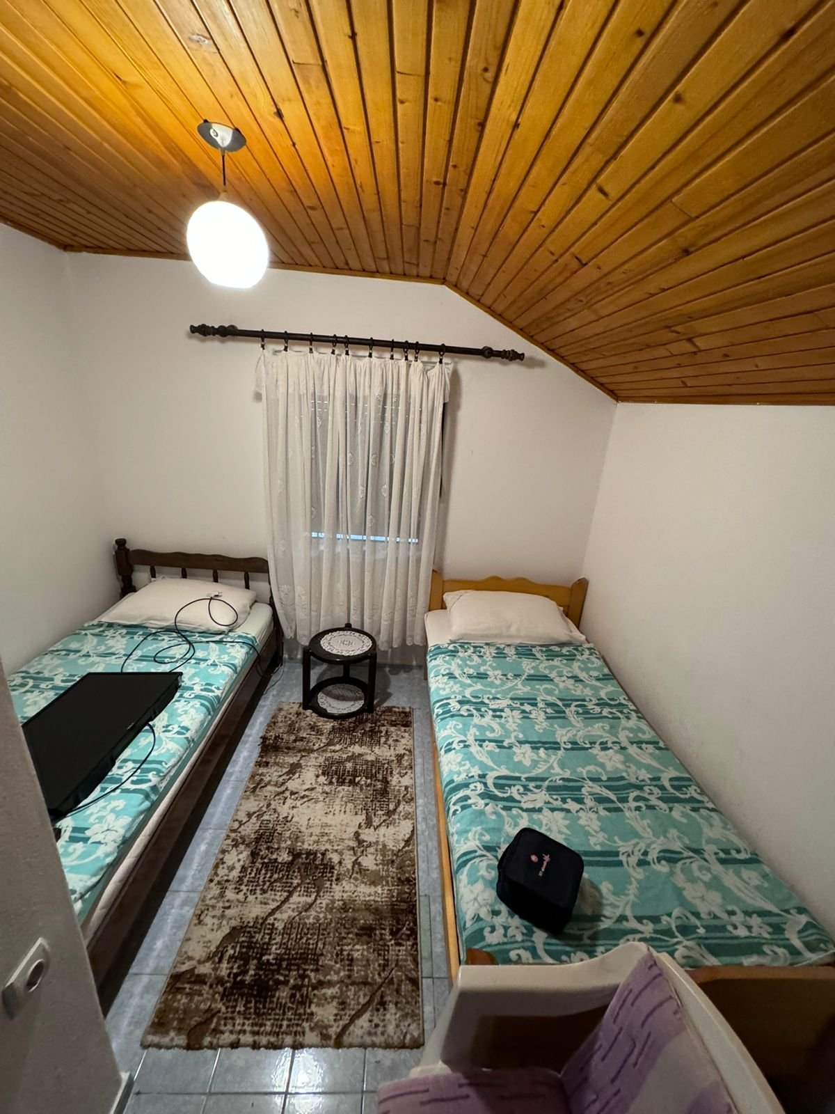 Charming Ulcinj room for sale: twin beds, stylish decor, cozy wood ceiling. Top Montenegro real estate&mdash;via ekosphere doo project.