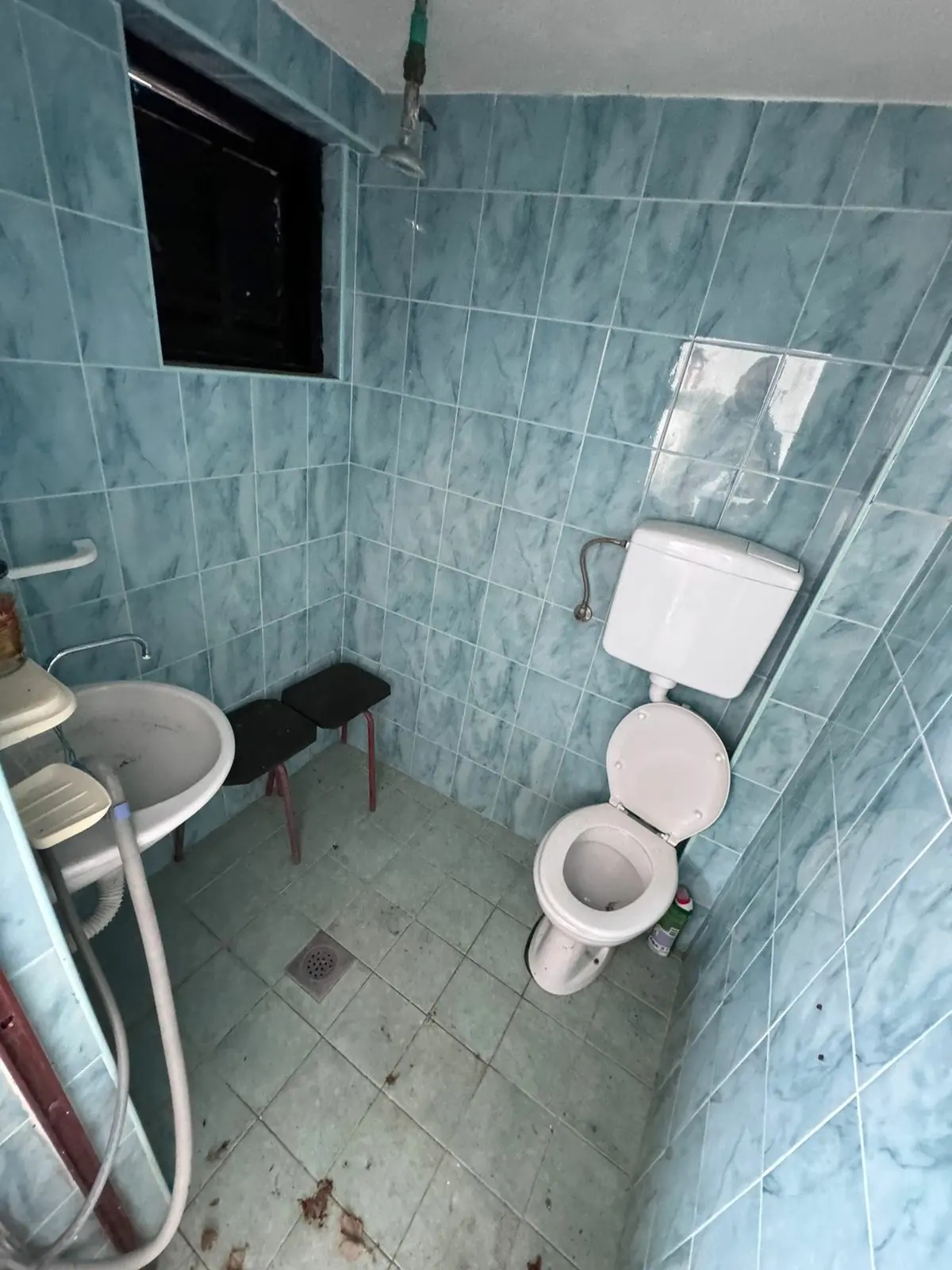 Modern Ulcinj bathroom with blue tiles, window, updated fixtures&mdash;invest in Montenegro property via immorenta.me by ekosphere doo.