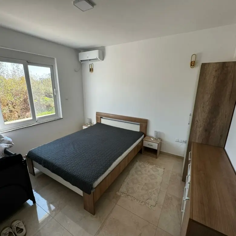 Modern Ulcinj bedroom: double bed, wardrobe, AC, views. Ideal Montenegro investment on immorenta.me by ekosphere doo.