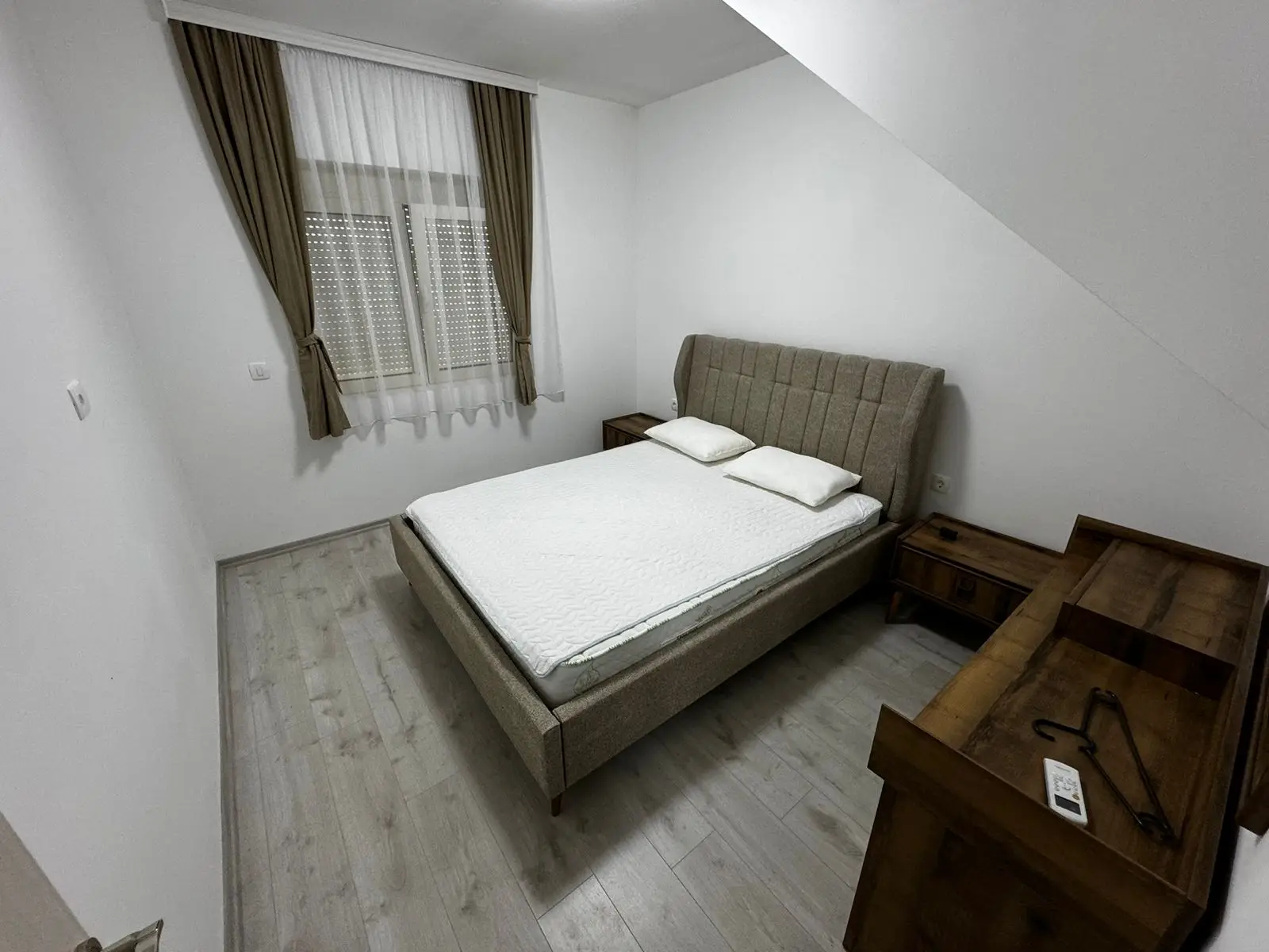 Modern Ulcinj bedroom with double bed, dresser, side tables, chic flooring; ideal real estate by immorenta.me/Ekosphere doo.