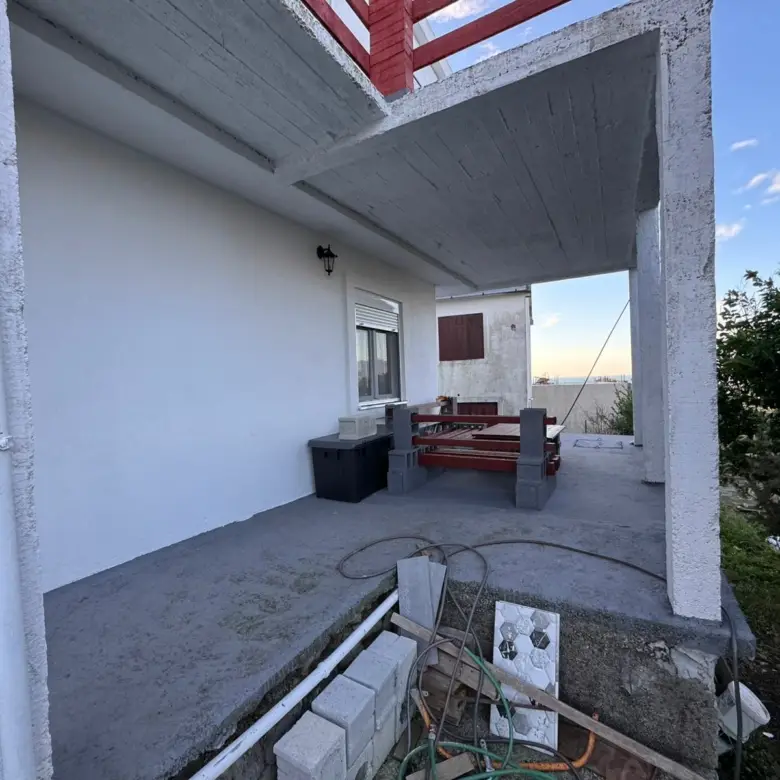 Spacious Ulcinj patio with scenic water and tree views, ideal for investing in Montenegro real estate by Ekosphere at immorenta.me.