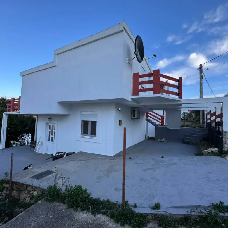 Modern white house with flat roof, red railings in Ulcinj, Montenegro&mdash;prime investment property listed on immorenta.me by ekosphere doo.