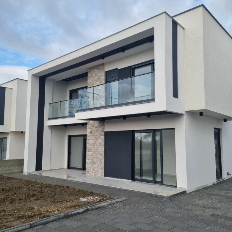 Elegant two-story home for sale in Ulcinj, Montenegro, featuring luxury finishes. Listed on immorenta.me by ekosphere doo.