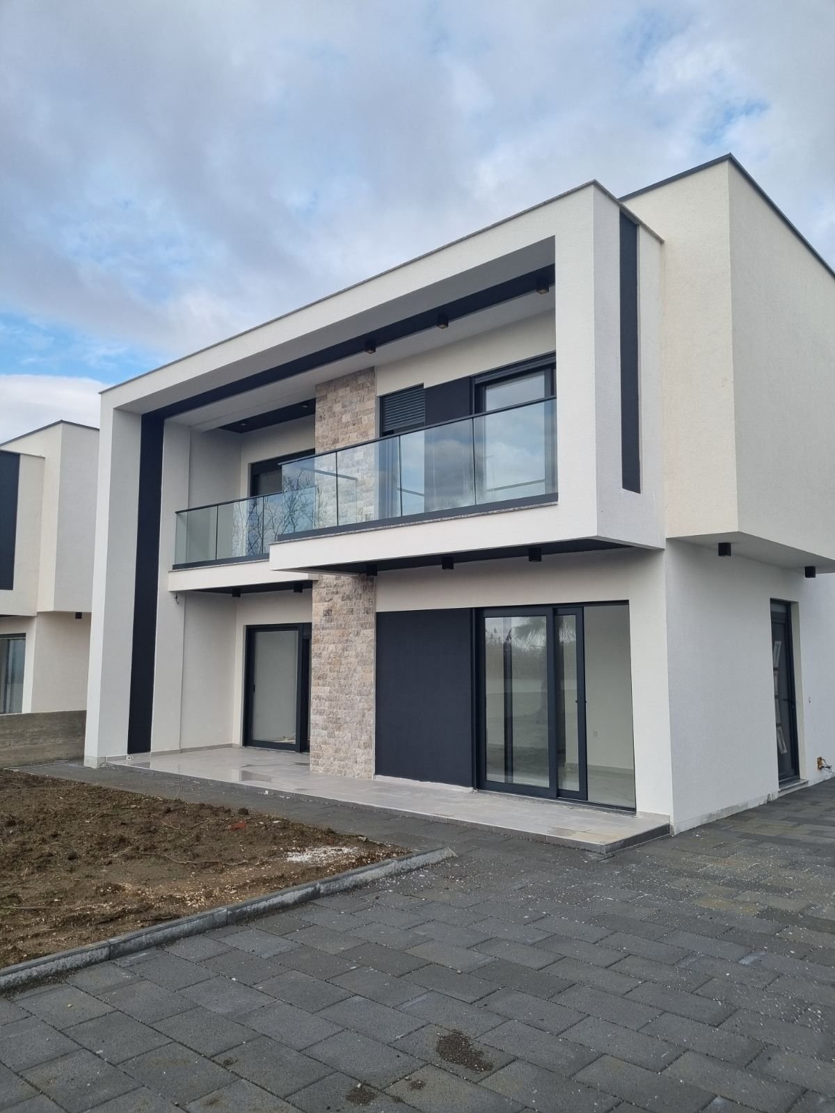 Elegant two-story home for sale in Ulcinj, Montenegro, featuring luxury finishes. Listed on immorenta.me by ekosphere doo.