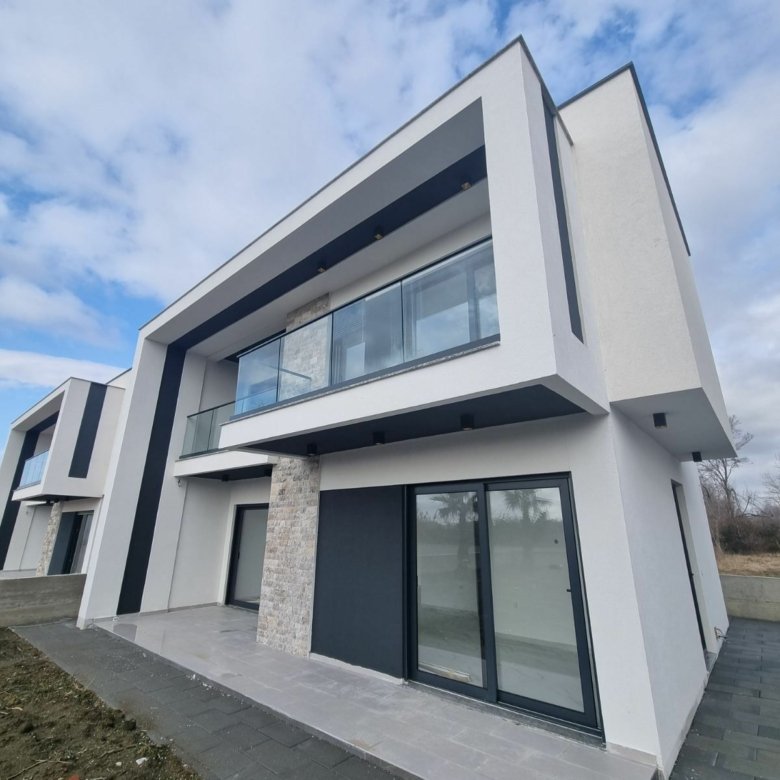 Stunning modern two-story home in Ulcinj with glass balcony, stone accents, and luxury finishes&mdash;exclusive by immorenta.me.