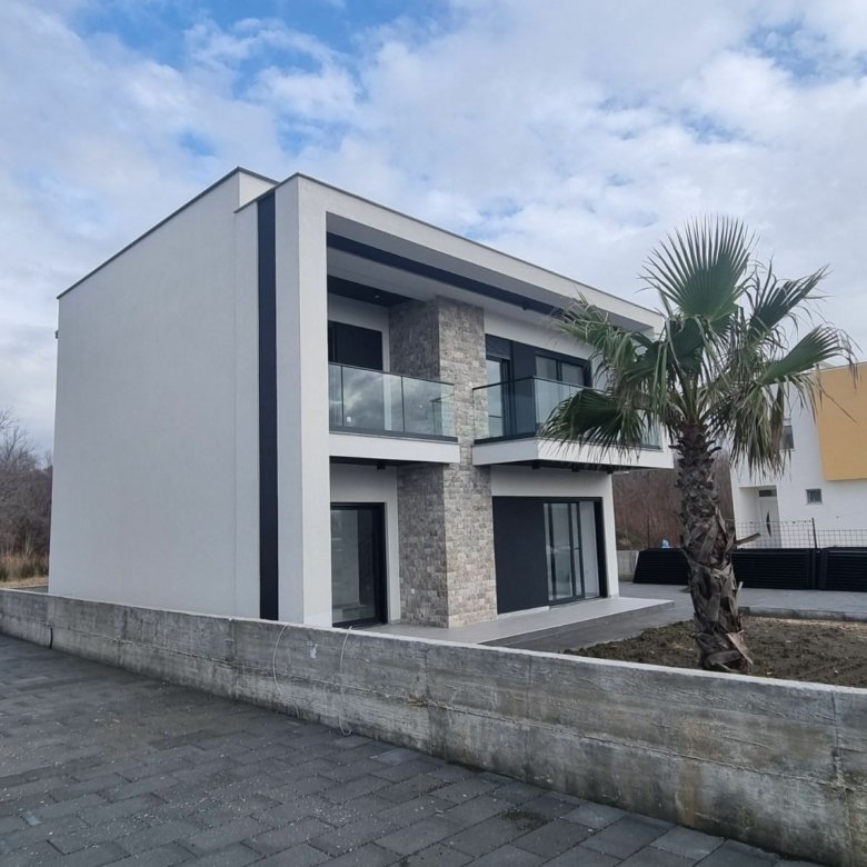 Luxury modern two-story home with glass balconies and stone accents in Ulcinj, Montenegro&mdash;prime investment via immorenta.me by ekosphere doo.