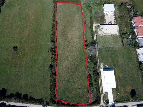 Prime rectangular land plot in Ulcinj, Montenegro&mdash;outlined in red, near homes & roads. Ideal investment via immorenta.me by Ekosphere.