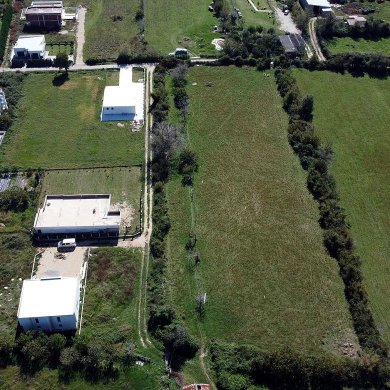 Premium Ulcinj properties: picturesque homes amid lush green fields, trees, and open land. Invest at immorenta.me&mdash;by ekosphere doo.