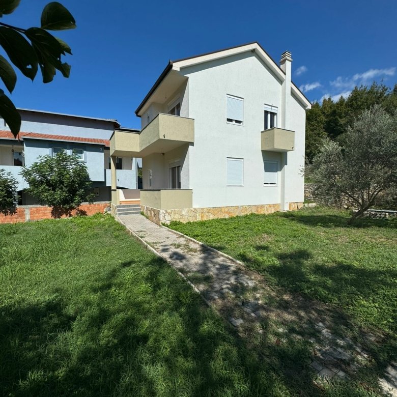 Elegant two-story white home with balconies in Ulcinj, Montenegro&mdash;ideal real estate investment. Listed by ekosphere doo on immorenta.me.