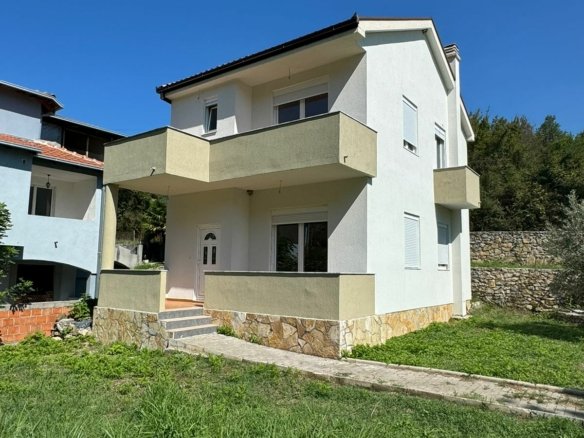 Stunning two-story white home with balconies and stone base in Ulcinj, Montenegro; ideal investment via immorenta.me by ekosphere doo.