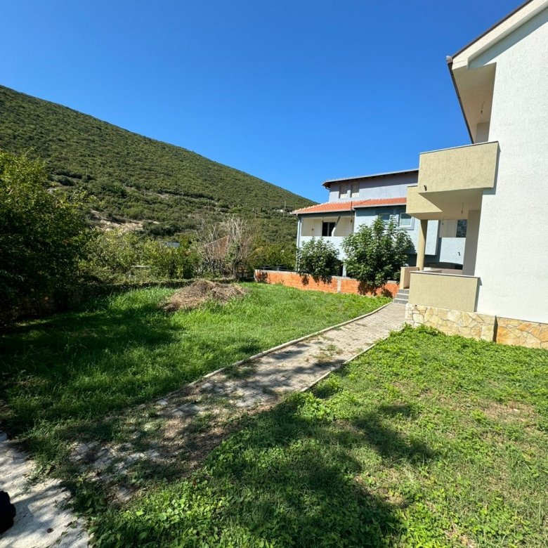 Modern white villa with balconies, lush yard, and mountain views in Ulcinj&mdash;prime Montenegro real estate from Ekosphere at immorenta.me.