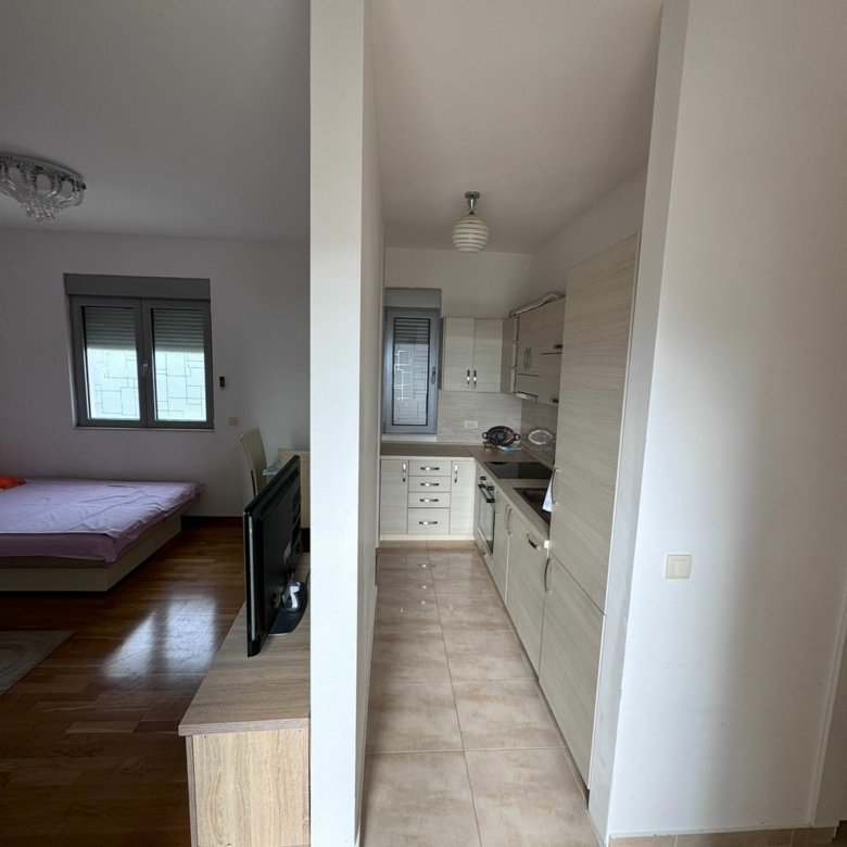 Modern Ulcinj apartment: cozy double bedroom, compact kitchen, smart layout ideal for investment. Listed on immorenta.me by ekosphere doo.