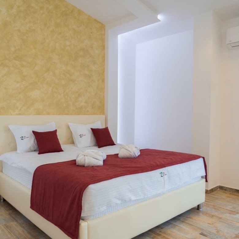 Bright Ulcinj property with wood floors, stylish bed, and modern decor&mdash;exclusive listing by immorenta.me, Ekosphere doo.