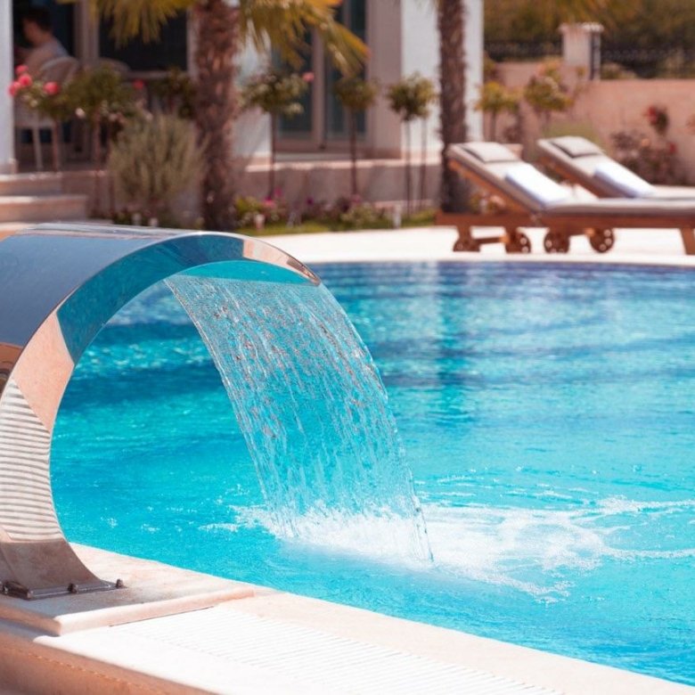 Luxury Ulcinj villa: sleek pool, waterfall feature, palm trees, stylish lounges&mdash;exclusive Montenegro real estate by Ekosphere | immorenta.me.