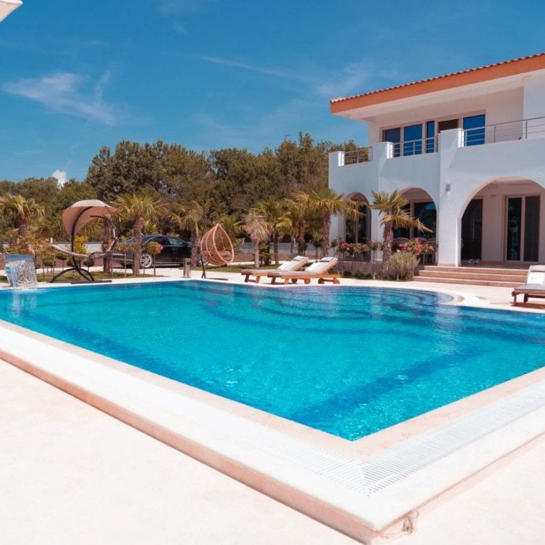 Seaside Villas Luxury two-story Seaside Villa in Ulcinj with balconies, pool, and palms in Ulcinj&rsquo;s Ekosphere&mdash;invest at immorenta.me by Ekosphere doo.