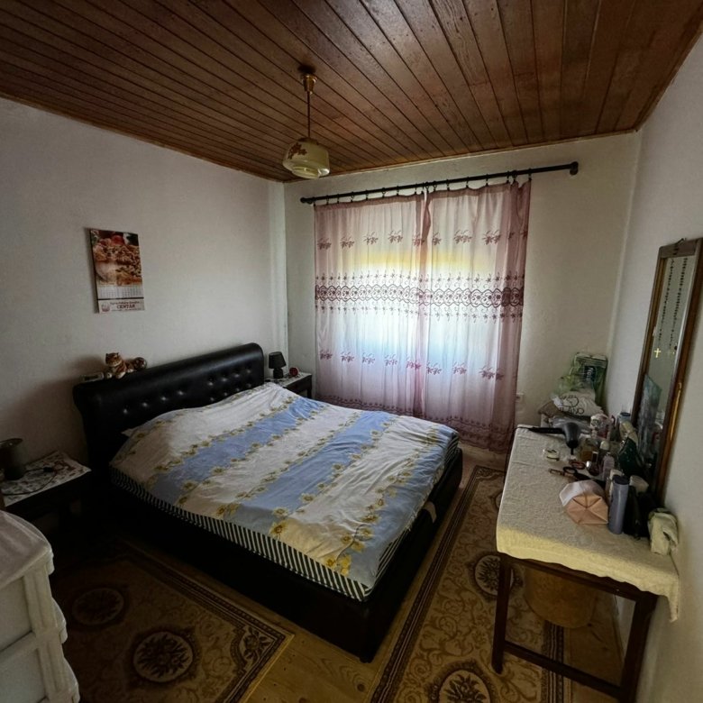 Charming Ulcinj bedroom with double bed, wood ceiling, pink curtains&mdash;ideal Montenegro real estate by ekosphere doo on immorenta.me.
