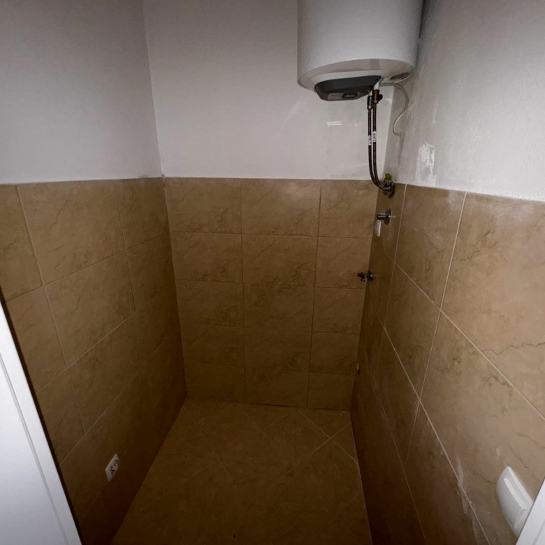 Bright, tiled utility room in Ulcinj, Montenegro with water heater&mdash;ideal investment, eco-friendly; on immorenta.me by ekosphere doo.