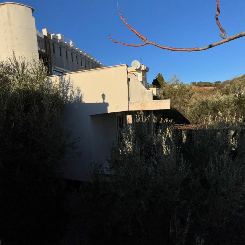 Modern white property for sale in Ulcinj, Montenegro, by Ekosphere DOO. Sunny roof with satellite dishes, clear sky&mdash;exclusive listing.