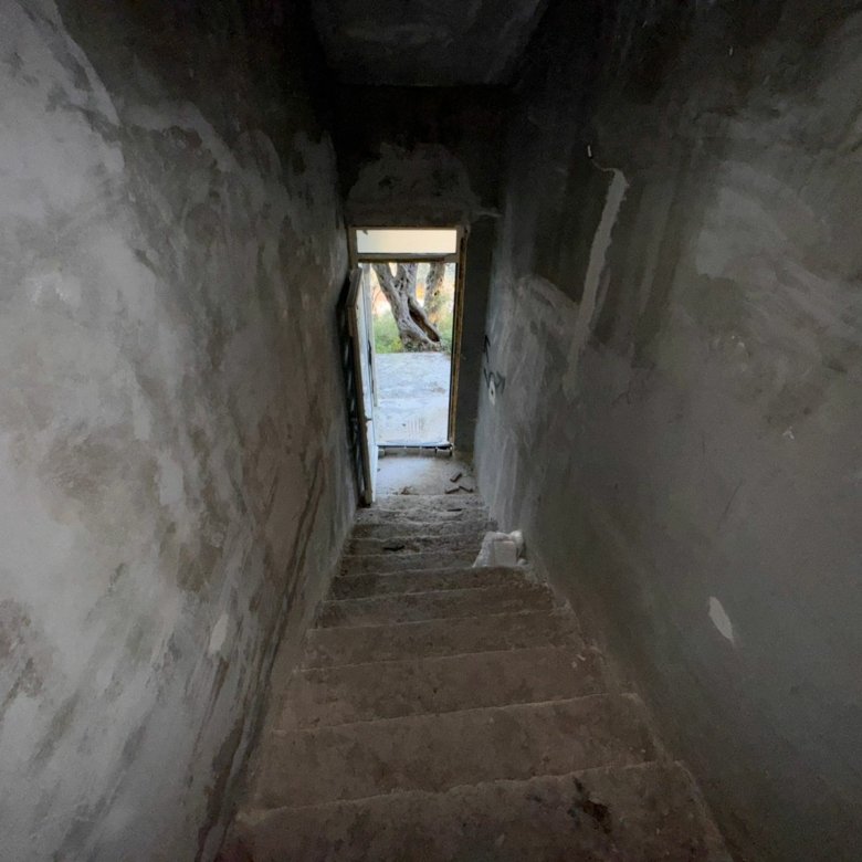 Discover investment potential in Ulcinj, Montenegro&mdash;unfinished concrete staircase, sunlit view, exclusive with immorenta.me by ekosphere doo.