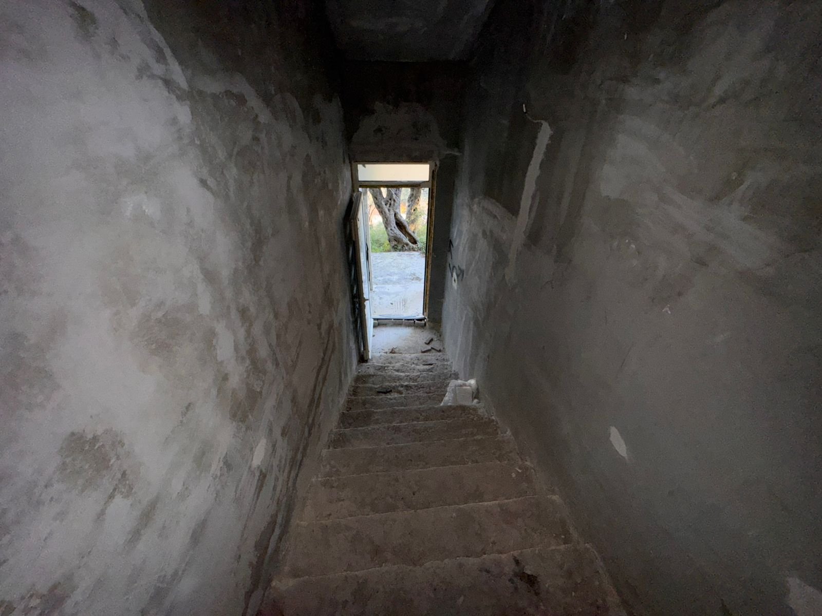 Discover investment potential in Ulcinj, Montenegro&mdash;unfinished concrete staircase, sunlit view, exclusive with immorenta.me by ekosphere doo.