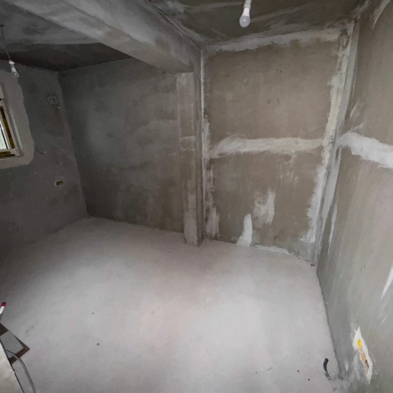 Unfinished room with concrete walls, small window&mdash;prime Ulcinj investment on immorenta.me by Ekosphere doo.