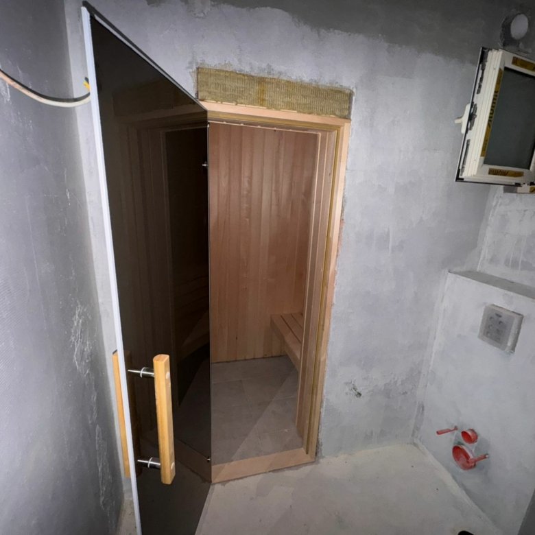 Investment opportunity in Ulcinj: unfinished space with concrete walls, exposed wires, wooden sauna; list on immorenta.me by Ekosphere.