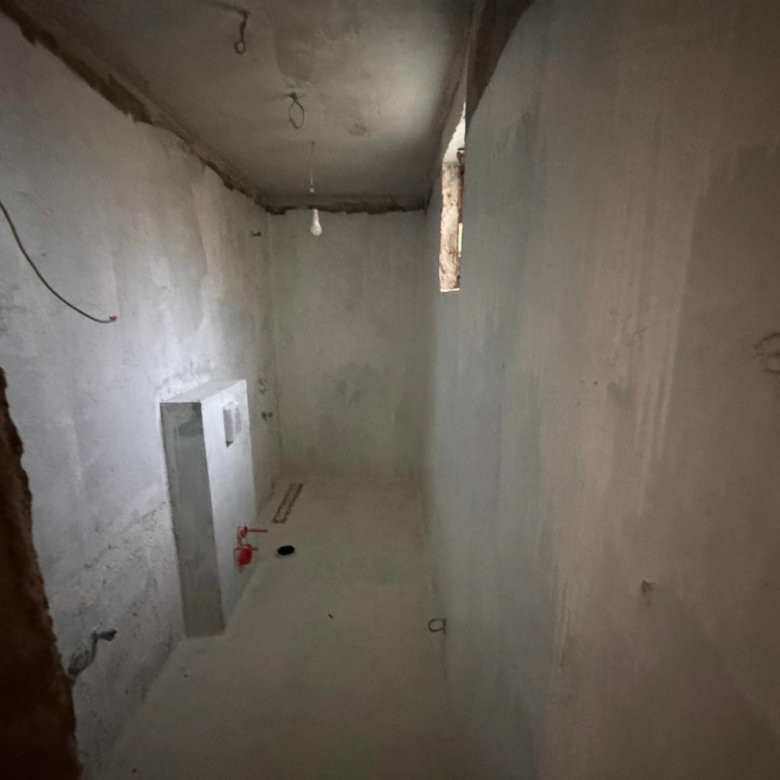 Unfinished Ulcinj investment property with concrete interiors, high window, exposed pipes&mdash;exclusive on immorenta.me by Ekosphere DOO.