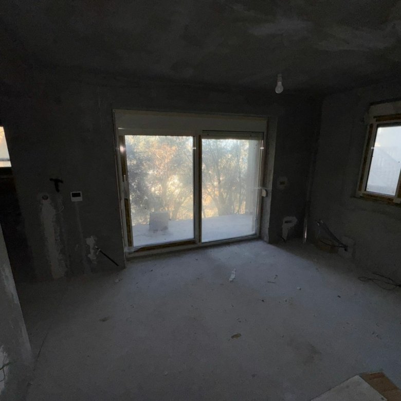 Spacious unfinished room in Ulcinj, Montenegro with balcony doors&mdash;prime investment to customize via ekosphere doo & immorenta.me.