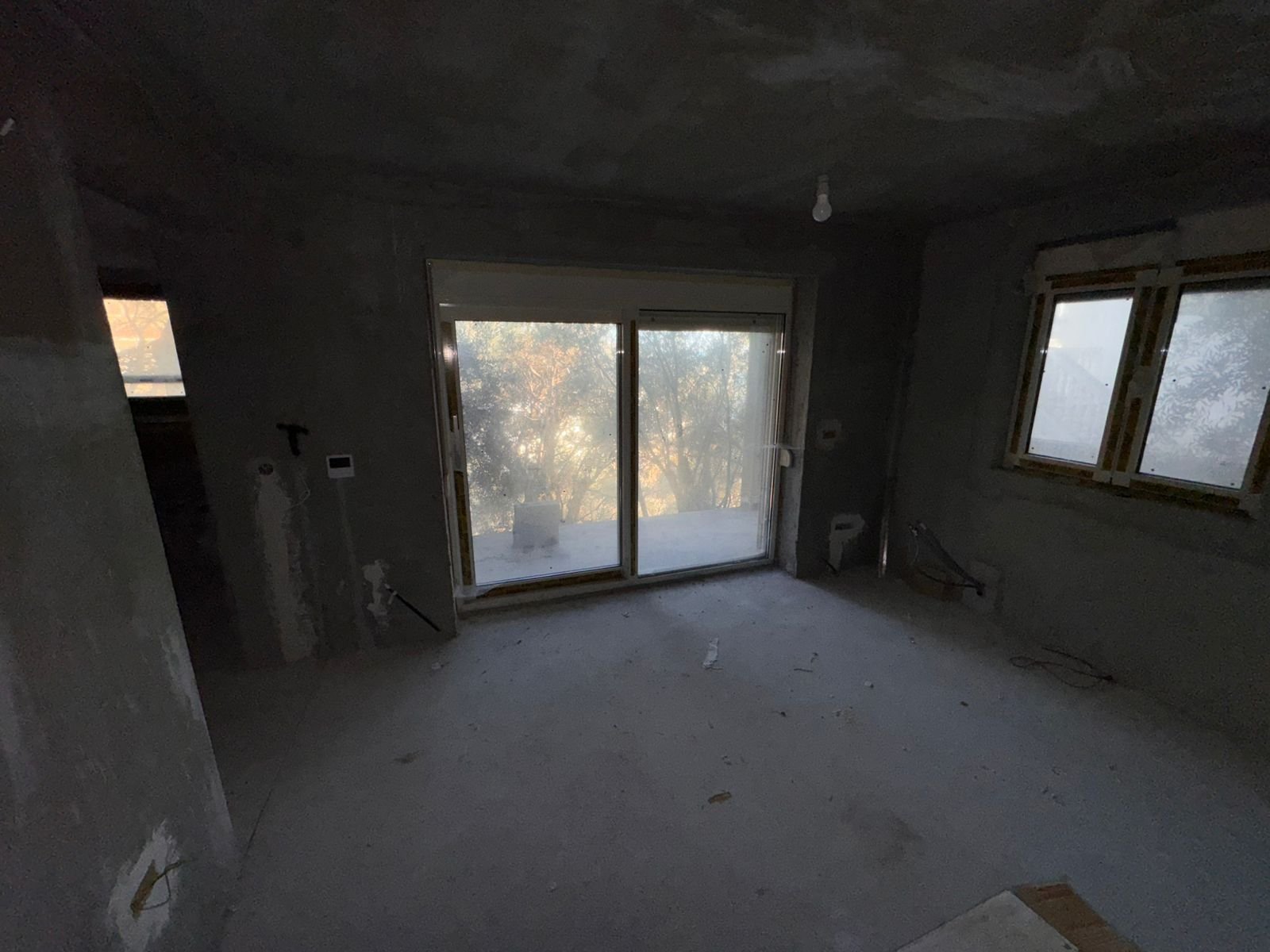 Spacious unfinished room in Ulcinj, Montenegro with balcony doors&mdash;prime investment to customize via ekosphere doo & immorenta.me.