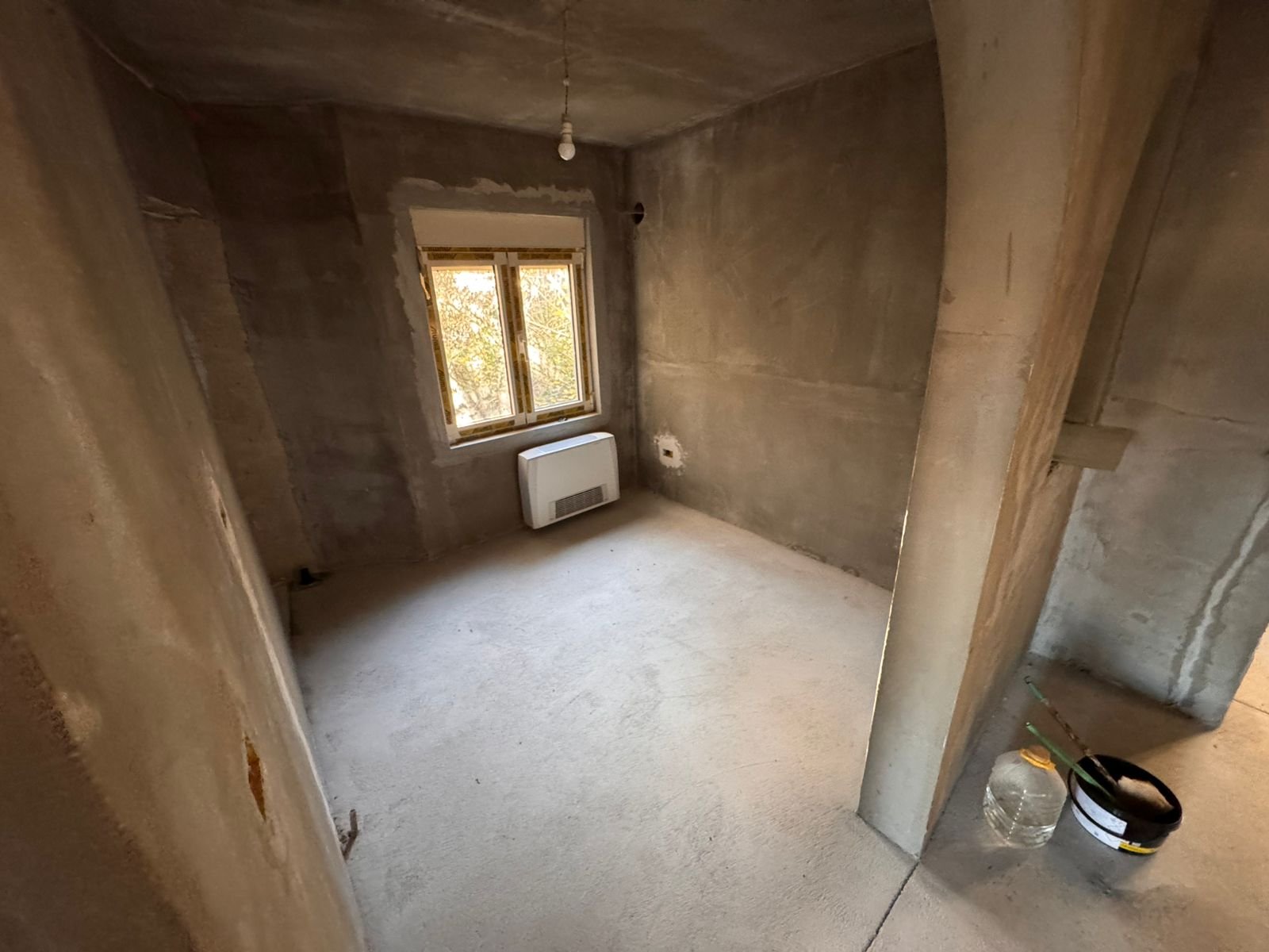Investment opportunity: Unfinished room in Ulcinj, Montenegro&mdash;concrete walls, window, heater. Exclusive on immorenta.me by ekosphere doo.