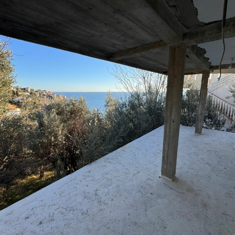 Stunning concrete balcony with wooden beams, sea views, and townscape&mdash;prime Ulcinj property on immorenta.me by Ekosphere Doo.