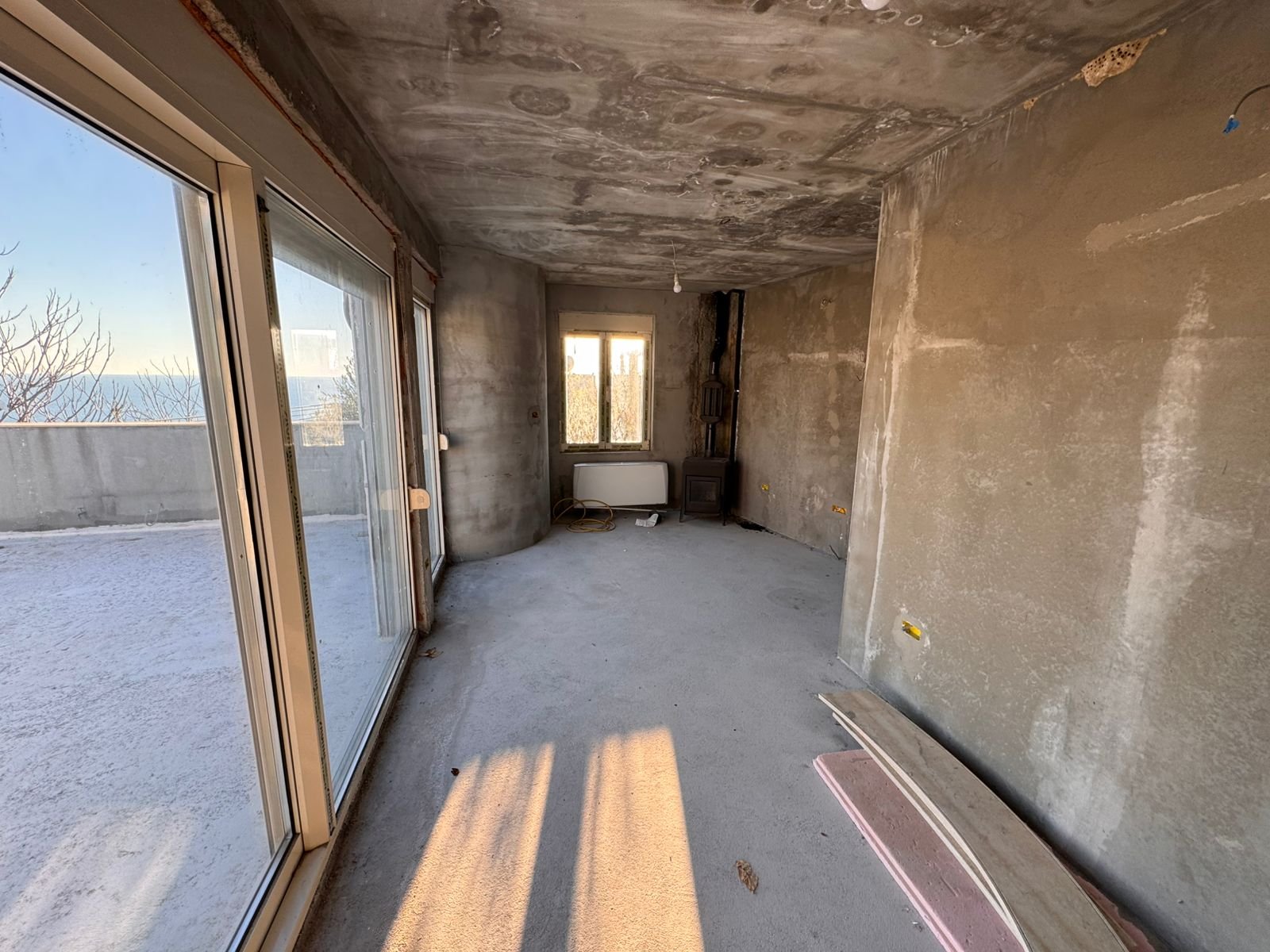 Unfinished Ulcinj property with panoramic balcony views, large windows, and investment potential&mdash;exclusive on immorenta.me by ekosphere doo.