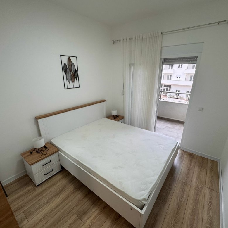 Minimal Ekosphere bedroom with premium finishes, balcony showcasing Ulcinj real estate views. Excl. at immorenta.me.