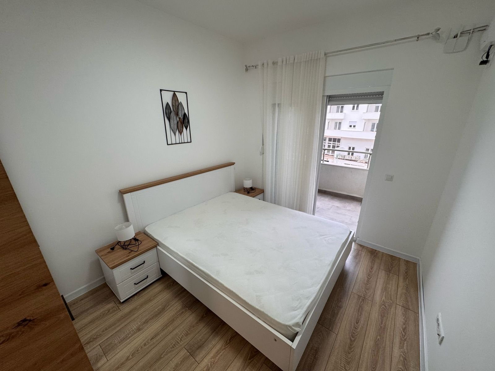 Minimal Ekosphere bedroom with premium finishes, balcony showcasing Ulcinj real estate views. Excl. at immorenta.me.
