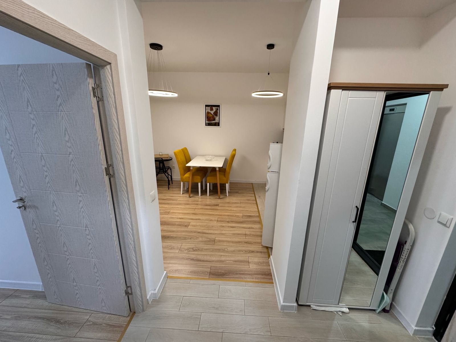 Bright dining area with wood floors, stylish lighting, and modern furnishings&mdash;ideal Ulcinj investment. Listed on immorenta.me by ekosphere doo.