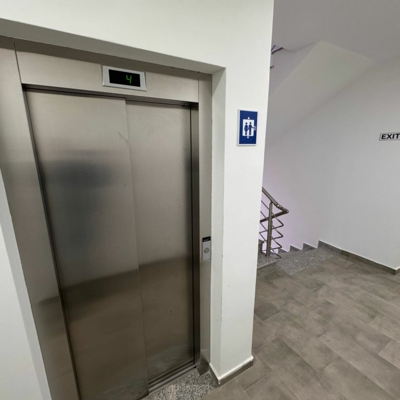 Modern Ulcinj property: closed elevator and sleek stairway, tiled floors, prime real estate&mdash;by ekosphere doo at immorenta.me.