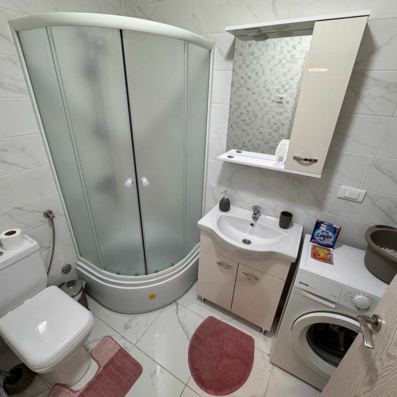 Modern Ulcinj bathroom: corner shower, stylish fixtures, washer, water heater&mdash;ideal investment on immorenta.me (ekosphere doo).