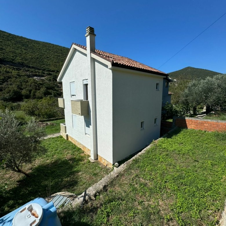 Modern white two-story house with red-tiled roof in Ulcinj, Montenegro&mdash;ideal investment listed on immorenta.me by Ekosphere.