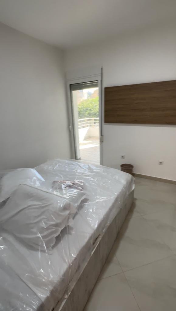 Modern Ulcinj bedroom with balcony access, double bed, tiled floor&mdash;prime Montenegro real estate by immorenta.me/Ekosphere.