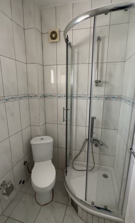 Modern, eco-friendly bathroom in Ulcinj property: white tiles, stylish shower, quality fittings. Ekosphere doo at immorenta.me.