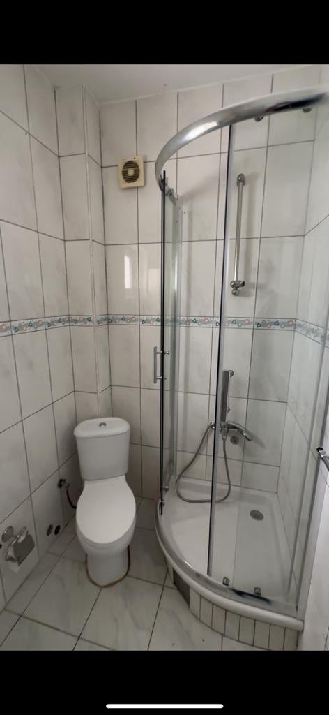 Modern, eco-friendly bathroom in Ulcinj property: white tiles, stylish shower, quality fittings. Ekosphere doo at immorenta.me.