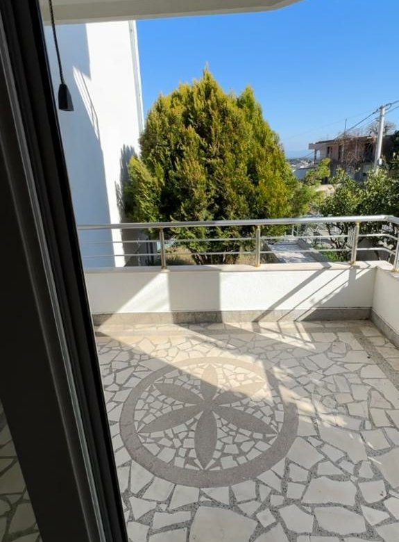 Stunning glass door view to a tiled balcony in Ulcinj, Montenegro&mdash;prime property by Ekosphere doo on immorenta.me.